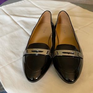 Black patent leather loafers.